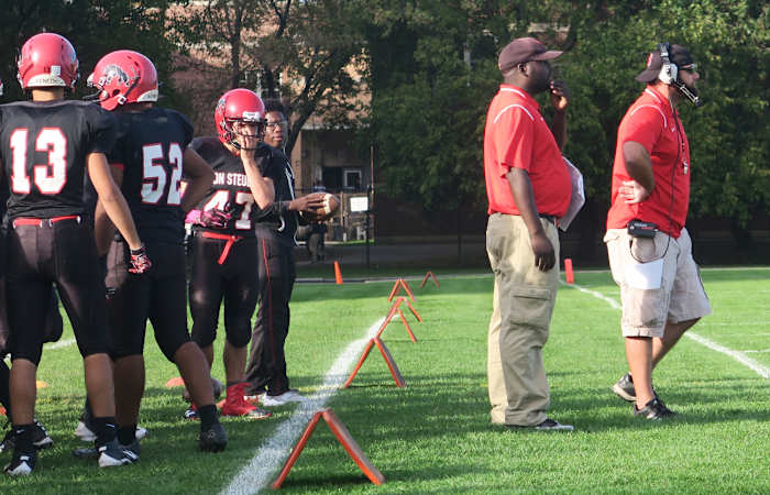 Von Steuben coach Alan Rood (right) working the sideline.
